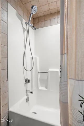 a bathroom with a sink toilet vanity and shower