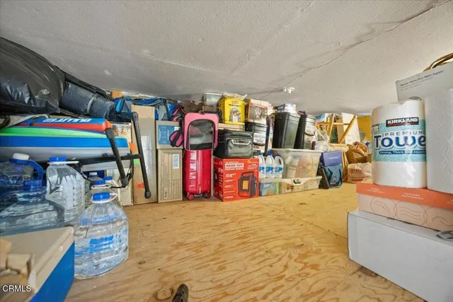a view of a house with backyard porch and sitting area