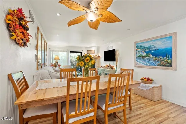 a living room with furniture large window and a fireplace
