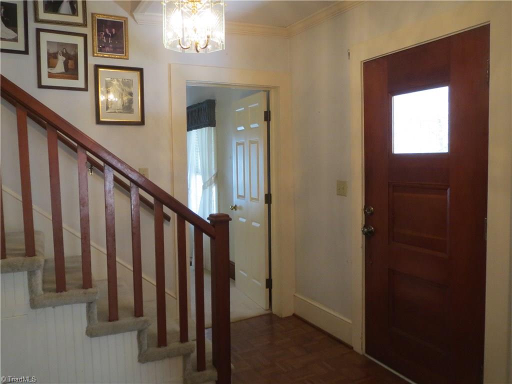 207 Ebenezer Church Road State Road, NC 28676 - Photo 5 of 30 Foyer features unique wood door, original woodwork and parkay floors.