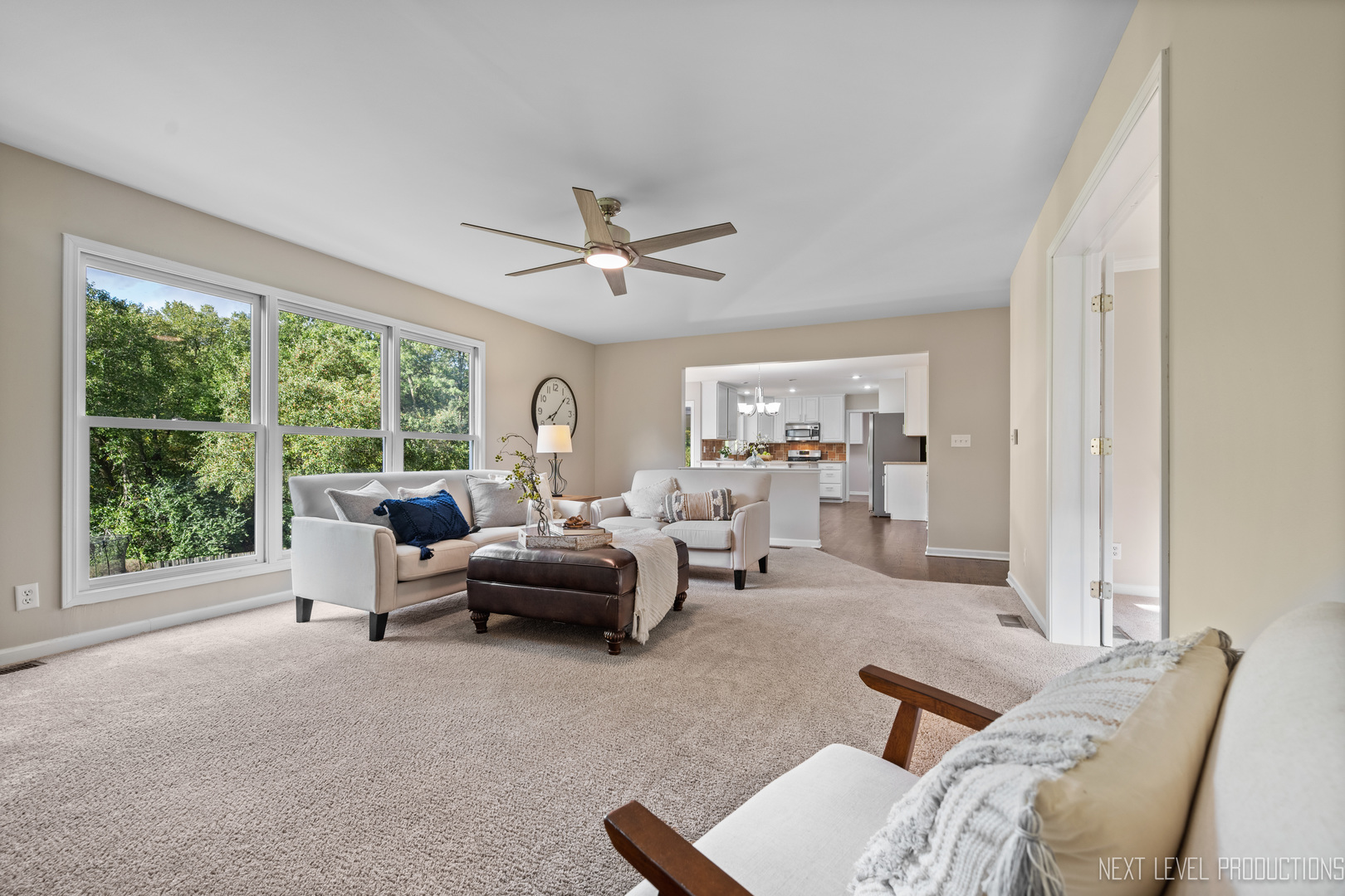 24 River Bend Road Montgomery, IL 60538 - Photo 11 of 36 a living room with furniture and a large window