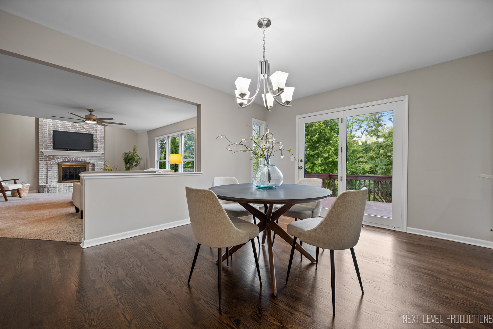 24 River Bend Road Montgomery, IL 60538 - Photo 16 of 36 a view of a dining room with furniture wooden floor and chandelier
