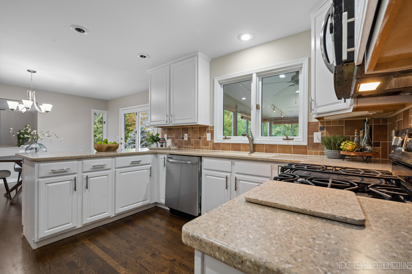 24 River Bend Road Montgomery, IL 60538 - Photo 17 of 36 a kitchen with a stove a sink and a refrigerator