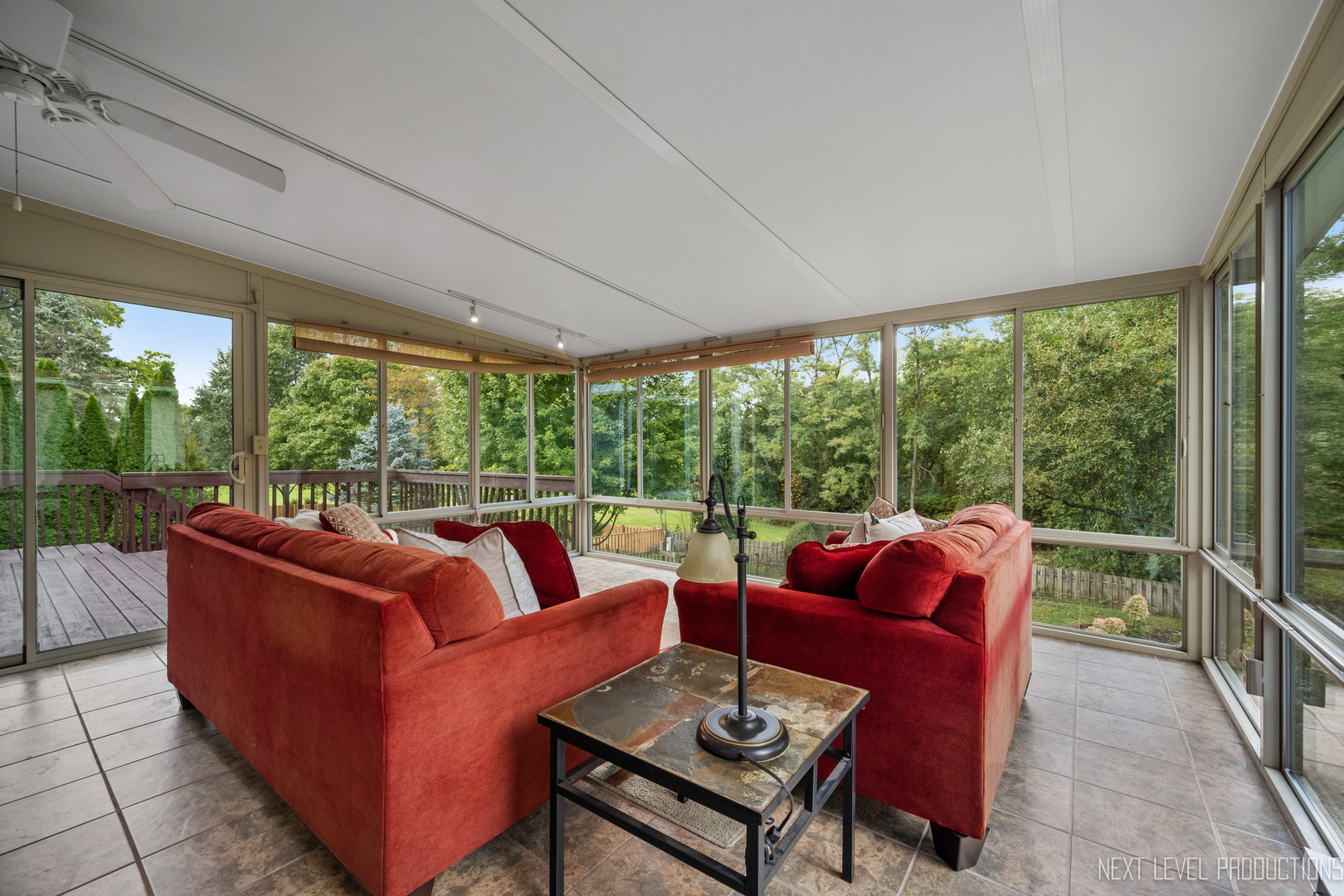 24 River Bend Road Montgomery, IL 60538 - Photo 19 of 36 a living room with furniture and a floor to ceiling window
