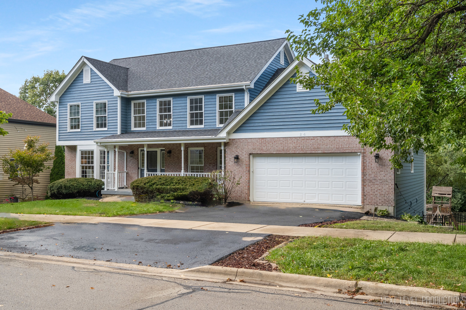 24 River Bend Road Montgomery, IL 60538 - Photo 2 of 36 a front view of a house with a yard and garage