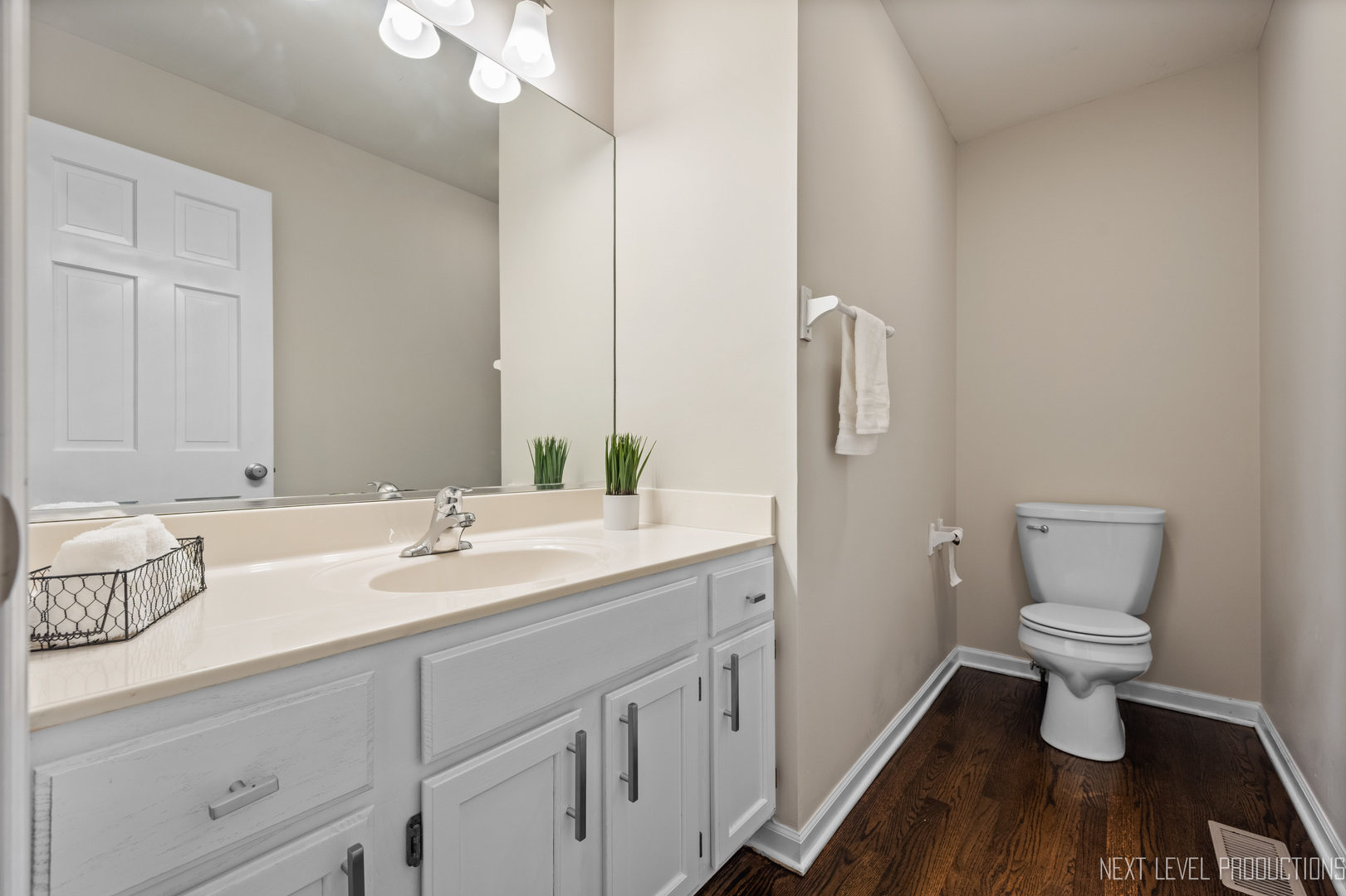 24 River Bend Road Montgomery, IL 60538 - Photo 21 of 36 a bathroom with a sink toilet a mirror and vanity
