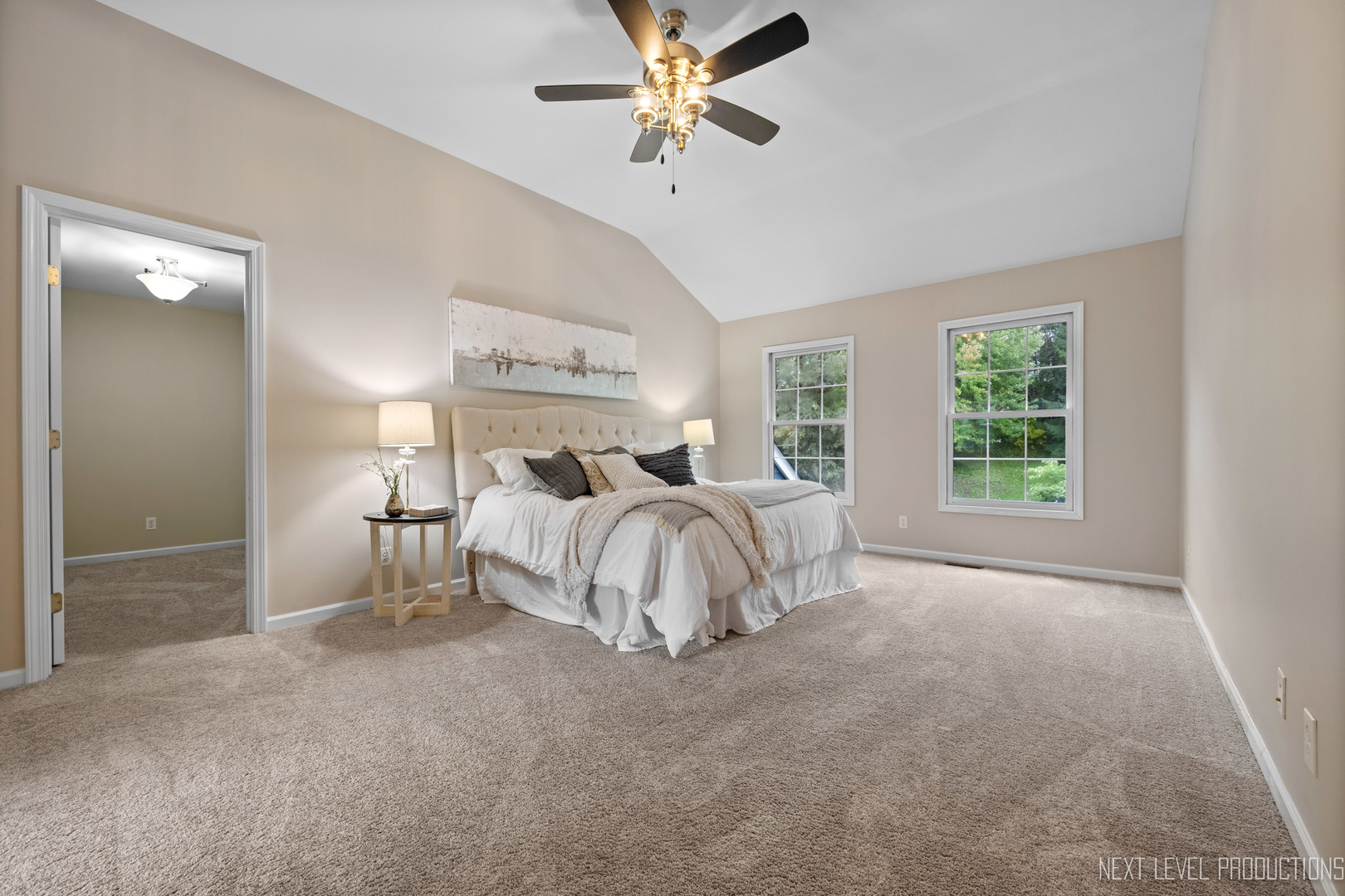 24 River Bend Road Montgomery, IL 60538 - Photo 22 of 36 a bed room with a bed and a chandelier