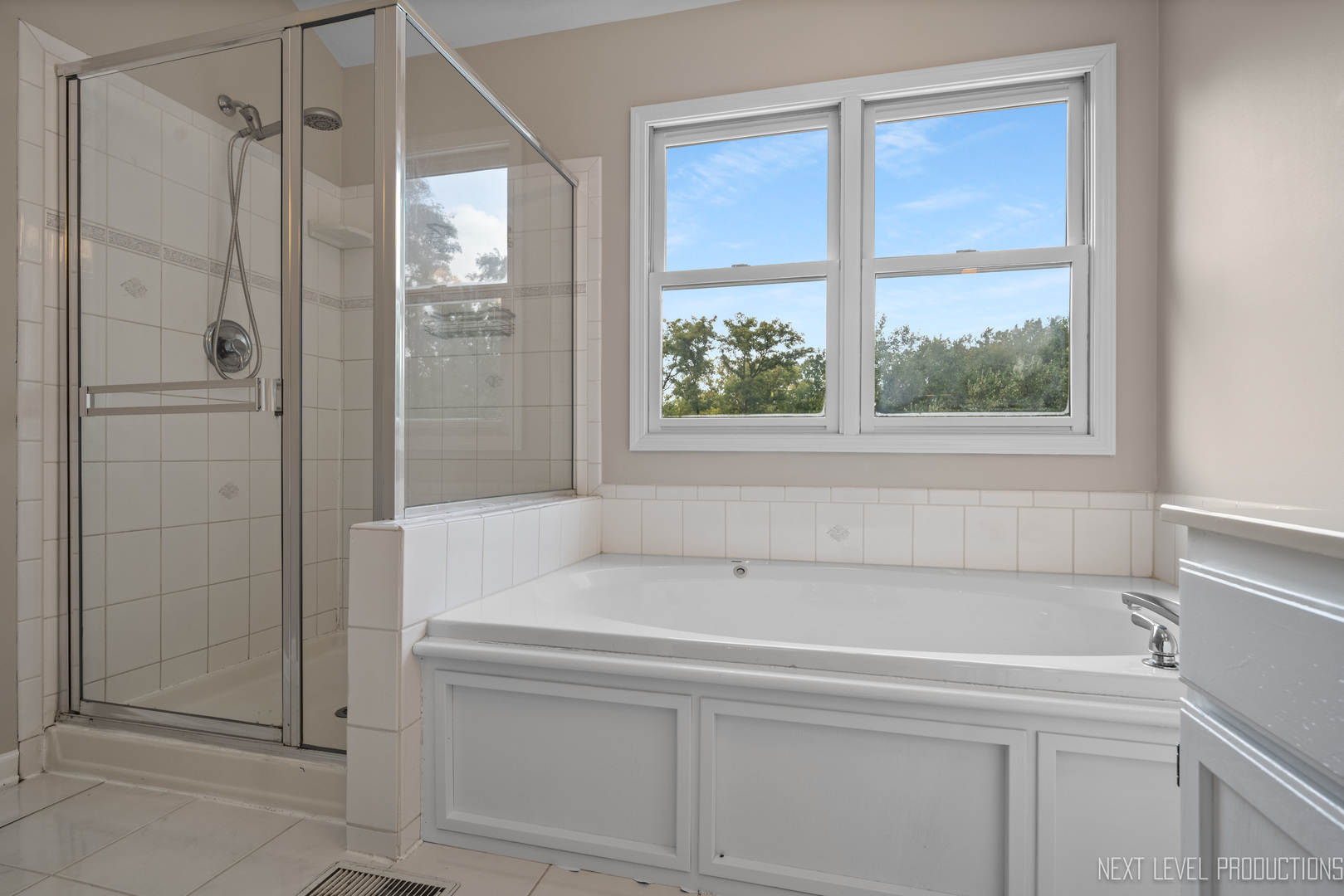 24 River Bend Road Montgomery, IL 60538 - Photo 24 of 36 a bathroom with a bathtub and a shower