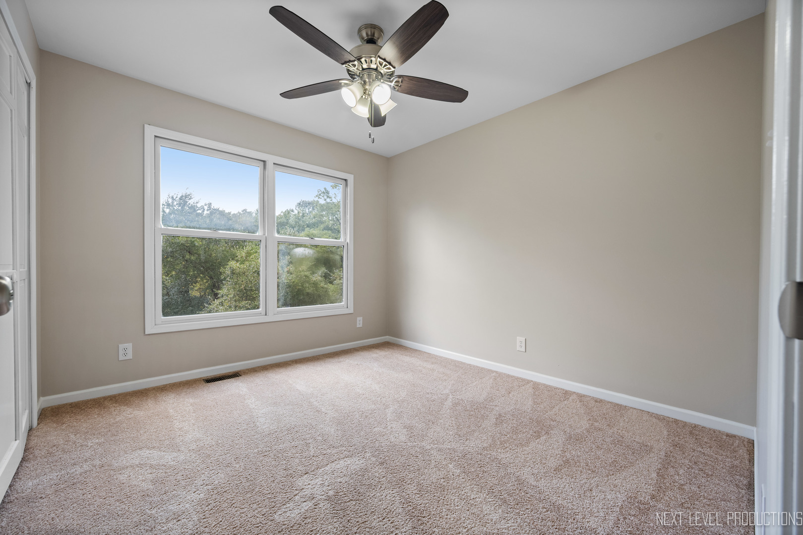 24 River Bend Road Montgomery, IL 60538 - Photo 29 of 36 an empty room with windows and fan