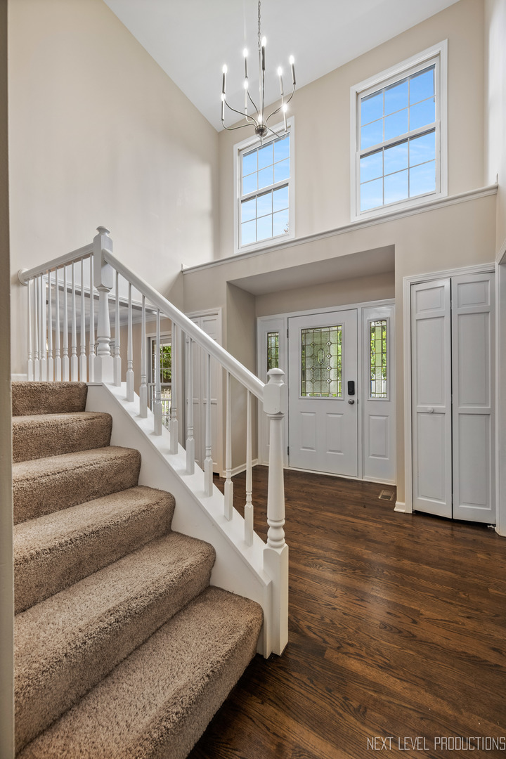 24 River Bend Road Montgomery, IL 60538 - Photo 5 of 36 a view of entryway and hall with wooden floor