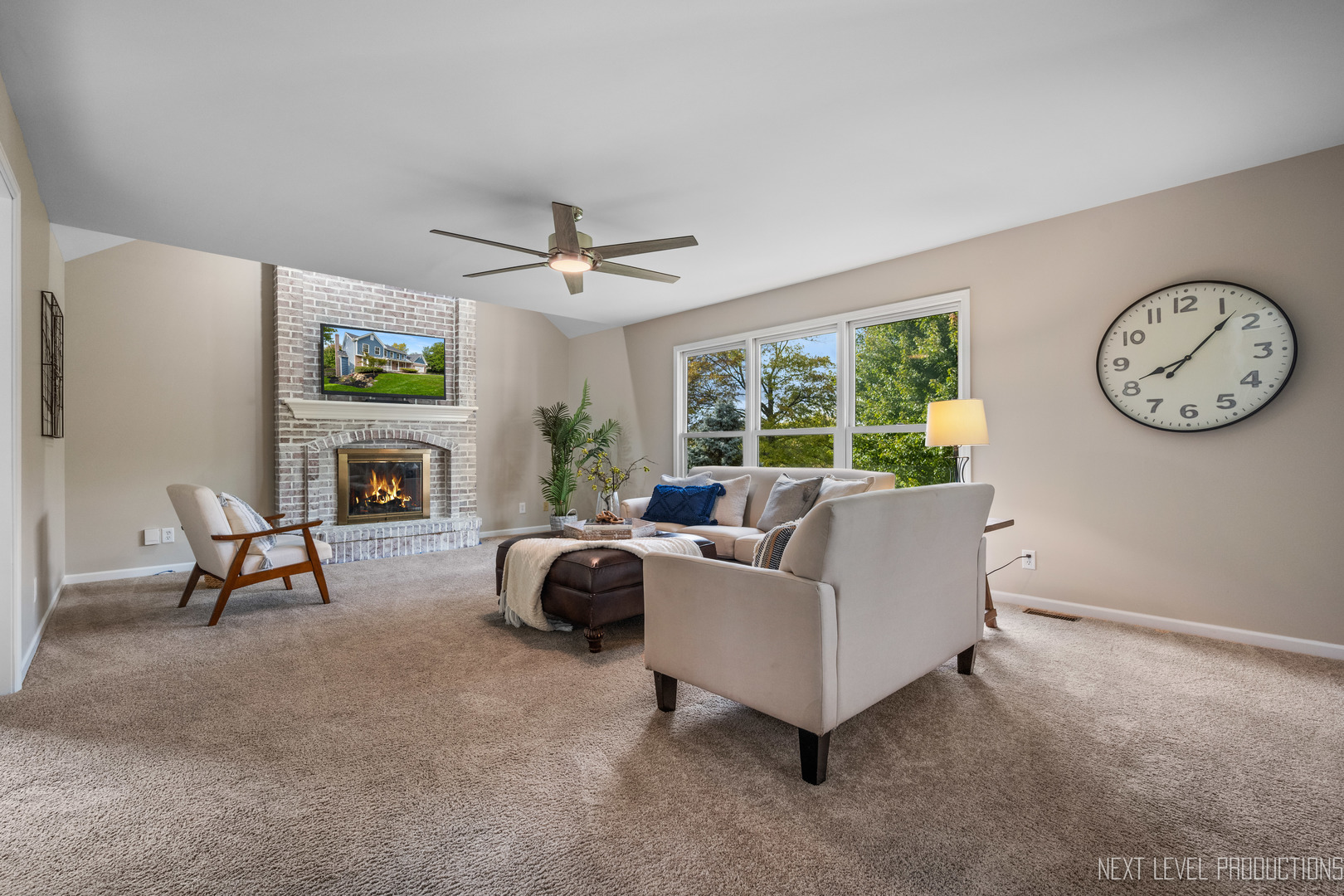 24 River Bend Road Montgomery, IL 60538 - Photo 10 of 36 a living room with furniture a fireplace and a large window