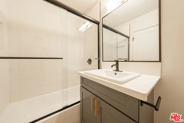 a bathroom with a sink and a bathtub