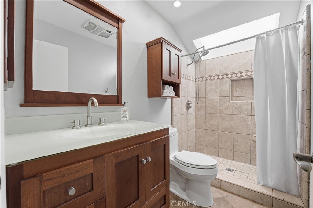 11 Shadowleaf Irvine, CA 92614 - Photo 11 of 23 Walk in shower with shaker style cabinetry in this primary bath