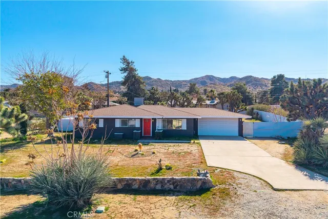 a view of swimming pool with a patio