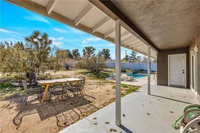 a view of a backyard with a patio