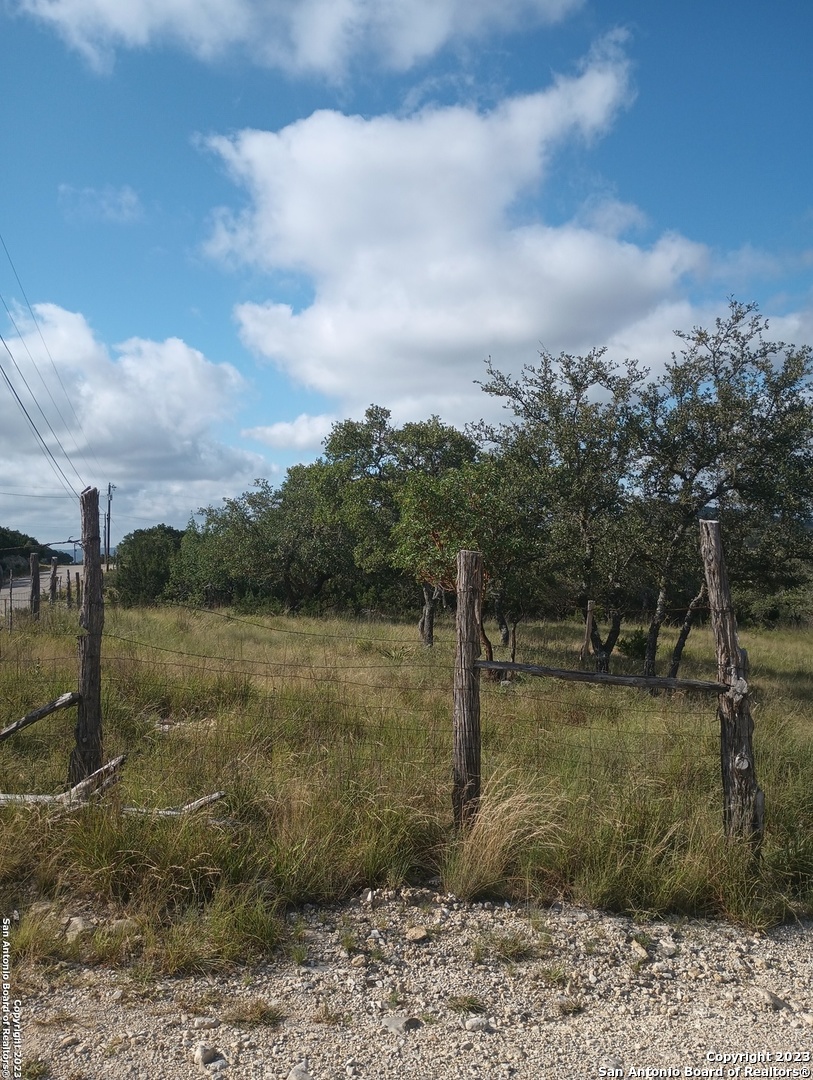 761 West Bear Springs Road Pipe Creek, TX 78063 - Photo 4 of 11 a view of a lake view with a house