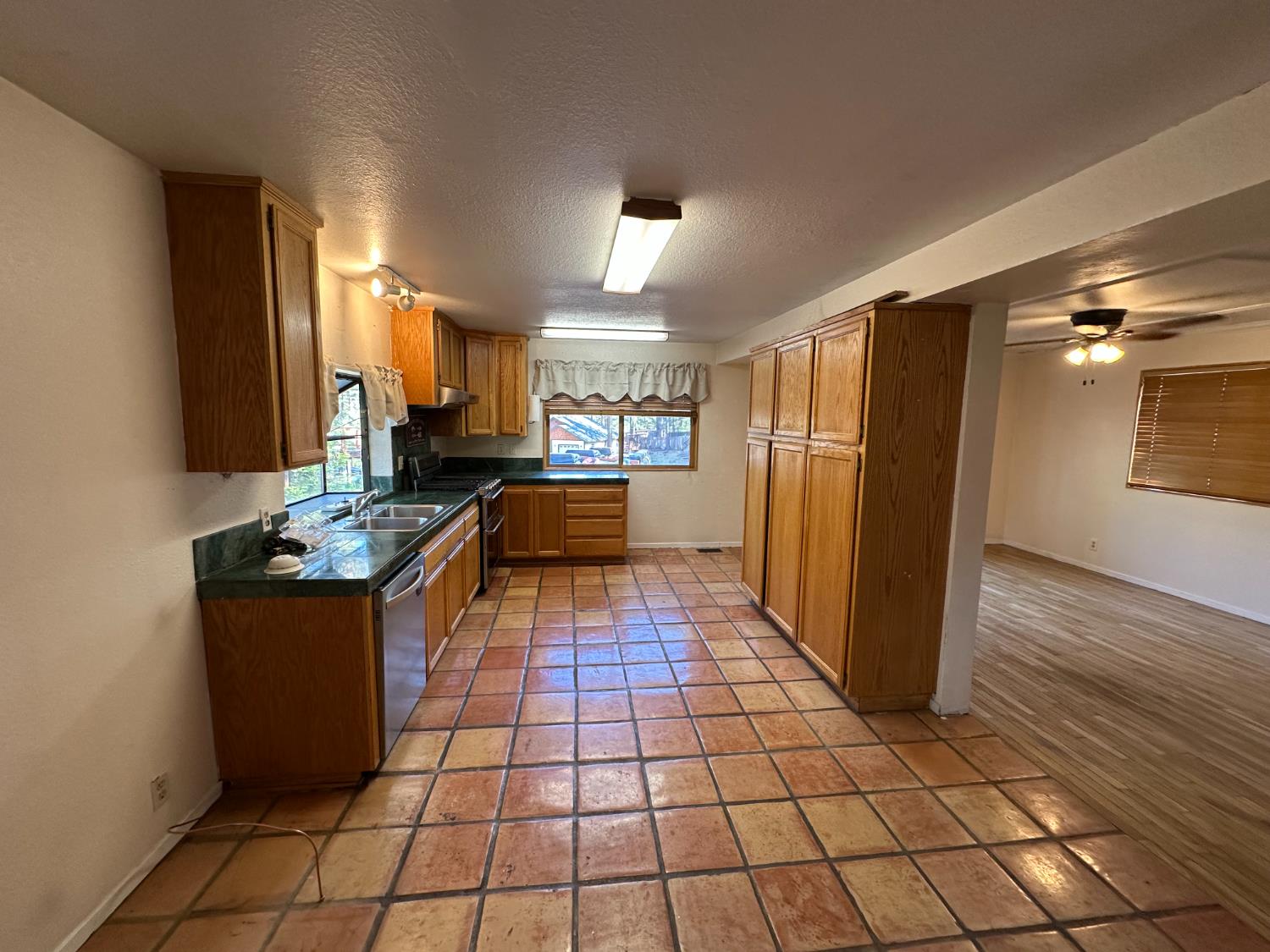878 Rheinfelder Street Portola, CA 96122 - Photo 17 of 36 a kitchen with stainless steel appliances granite countertop a refrigerator and a stove