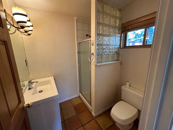 a bathroom with a sink a vanity and mirror