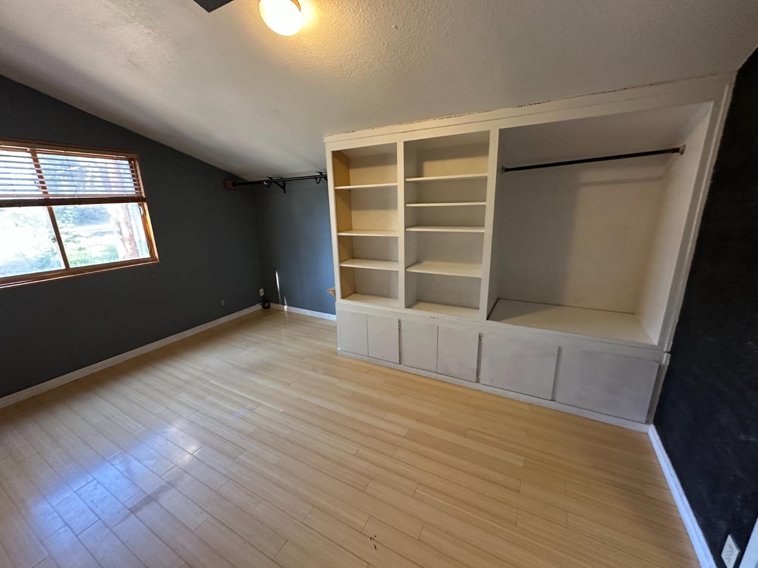 878 Rheinfelder Street Portola, CA 96122 - Photo 25 of 36 an empty room with wooden floor and windows