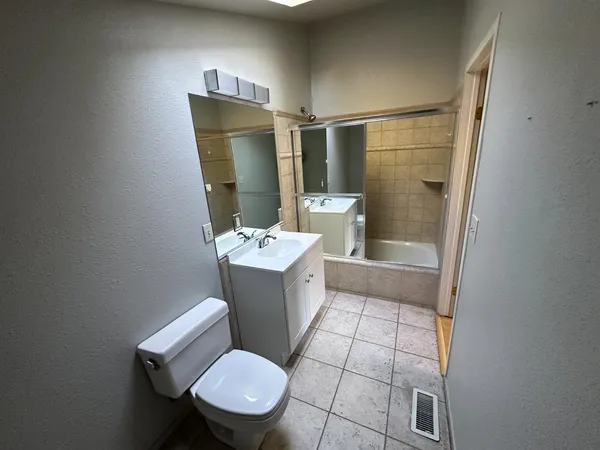 a bathroom with a sink and toilet