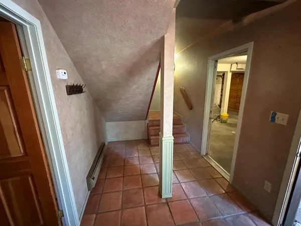 a view of an empty room with glass door