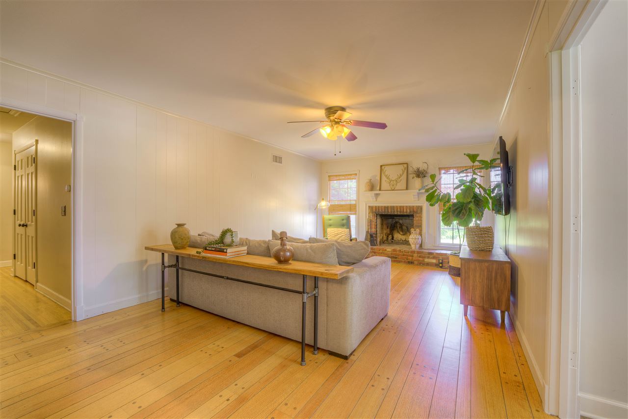 Large Den overlooks backyard. New Wood burning Fireplace. Wall of Bookshelves(not shown)