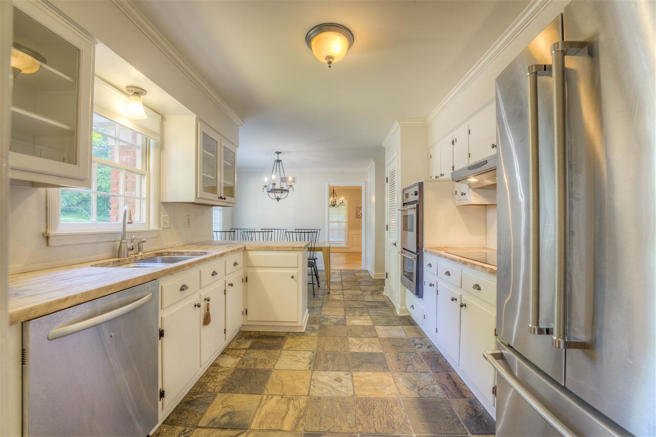 Beautiful Light Filled Kitchen. Sellers sanded butcher block counter tops but left unsealed for new owners to choose to stain or not.