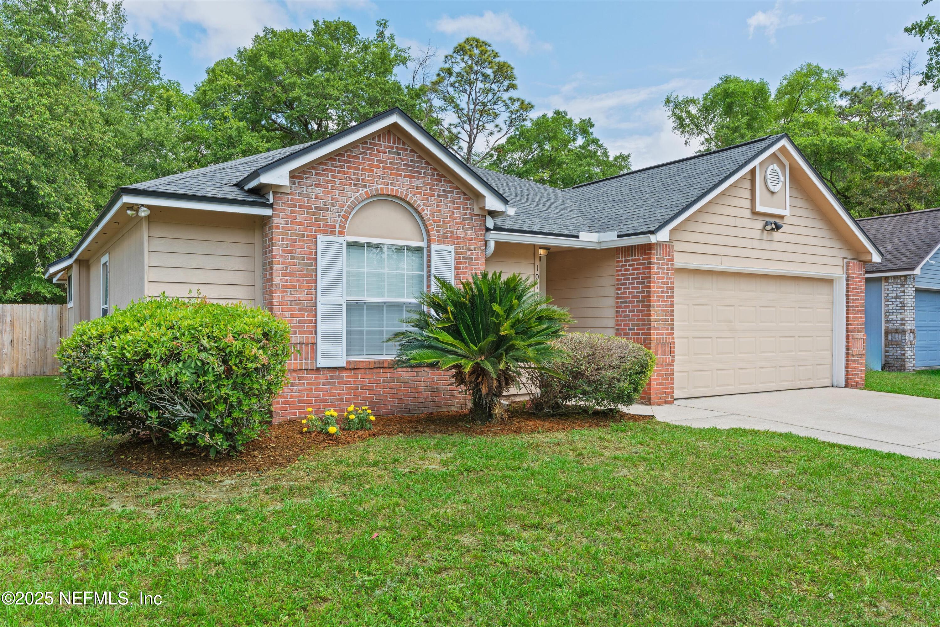 10713 Rutgers Road Jacksonville, FL 32218 - Photo 21 of 26 a front view of a house with a garden