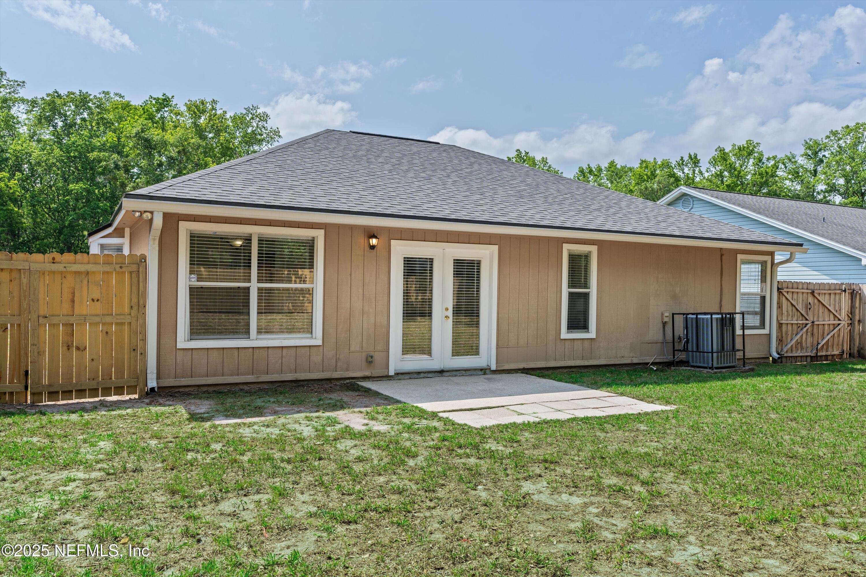 10713 Rutgers Road Jacksonville, FL 32218 - Photo 23 of 26 a view of a house with yard and a garden