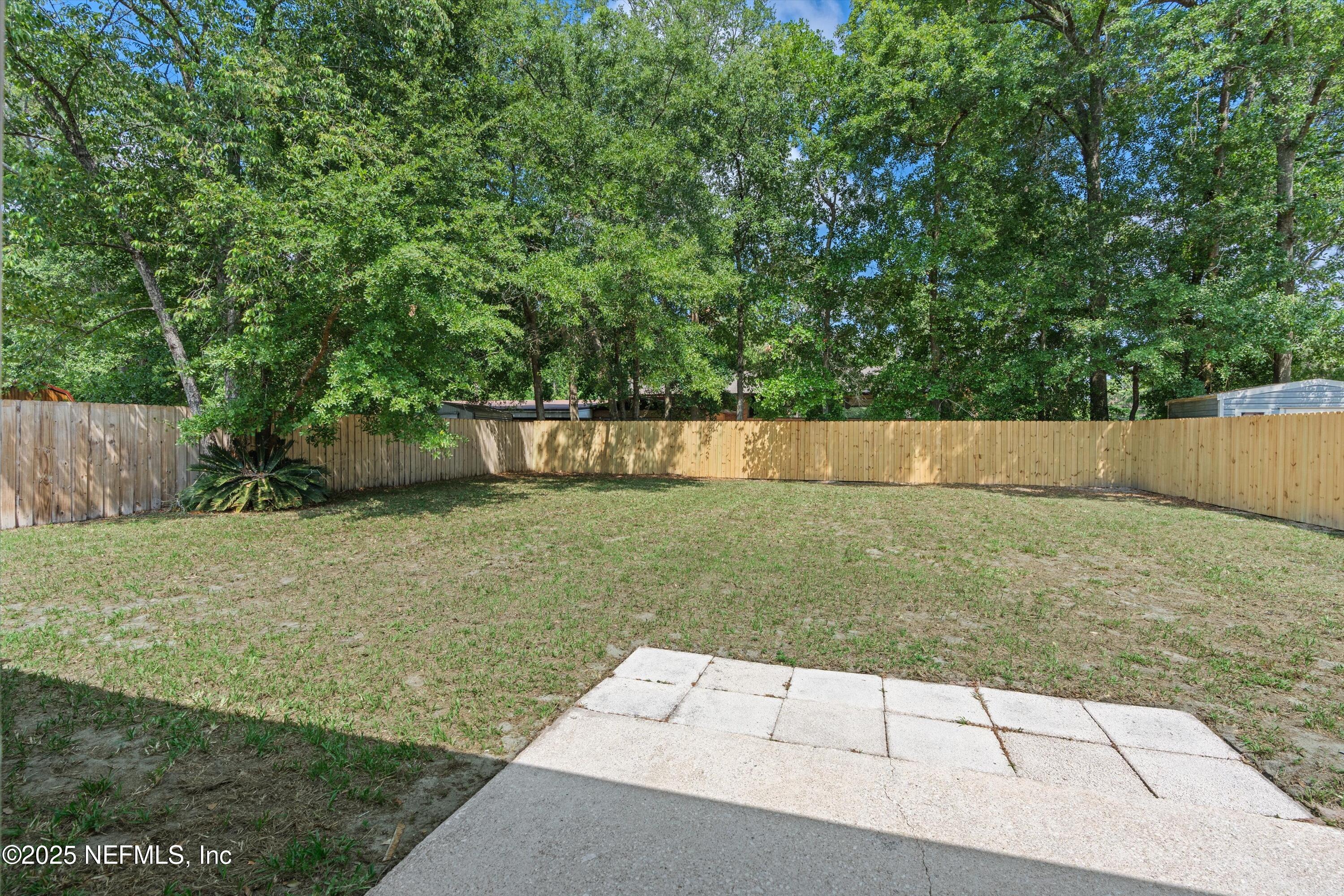 10713 Rutgers Road Jacksonville, FL 32218 - Photo 2 of 26 a view of backyard with green space