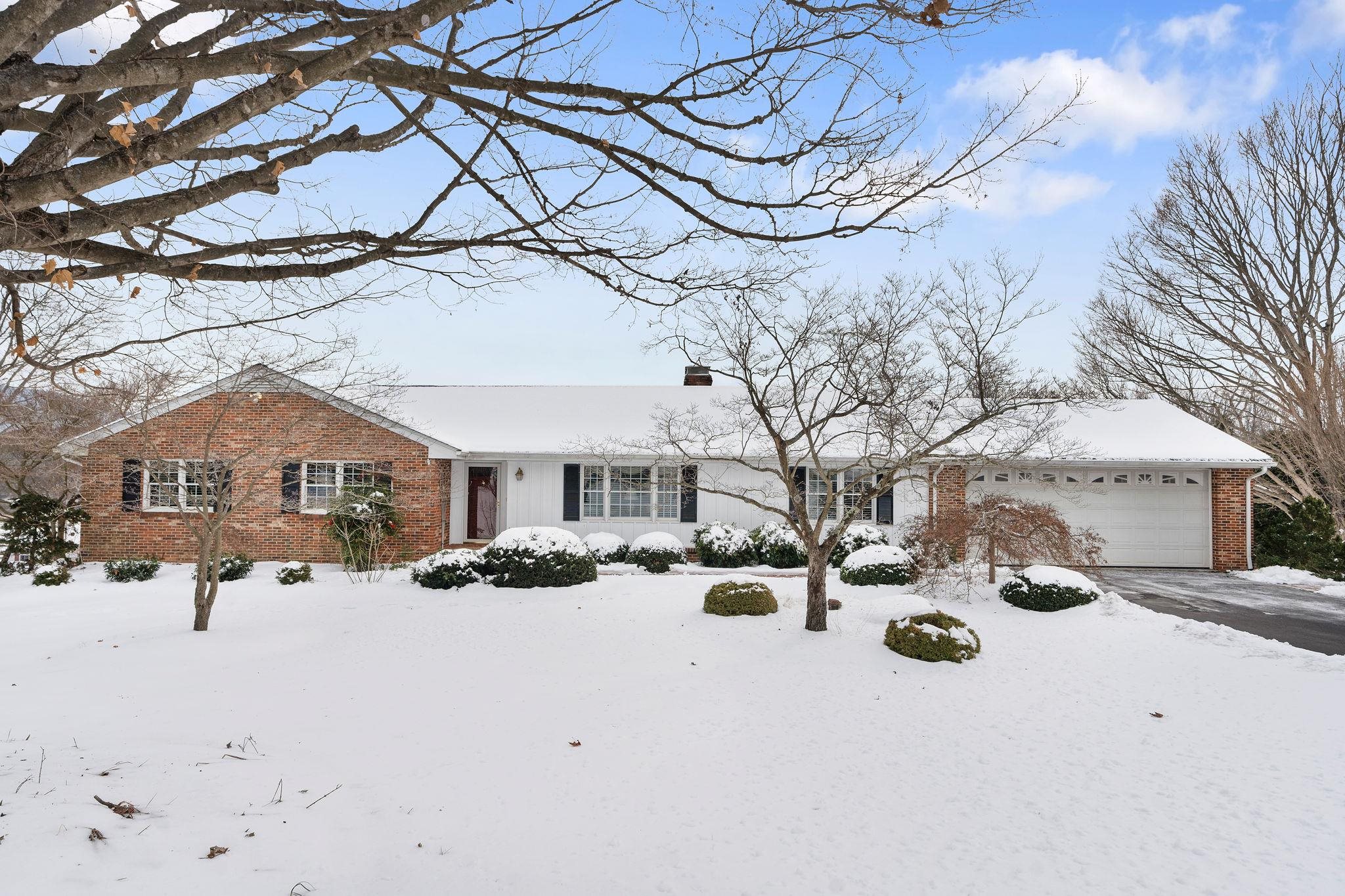 769 Cattle Scales Road Waynesboro, VA 22980 - Photo 1 of 75 a view of a white house covered in snow