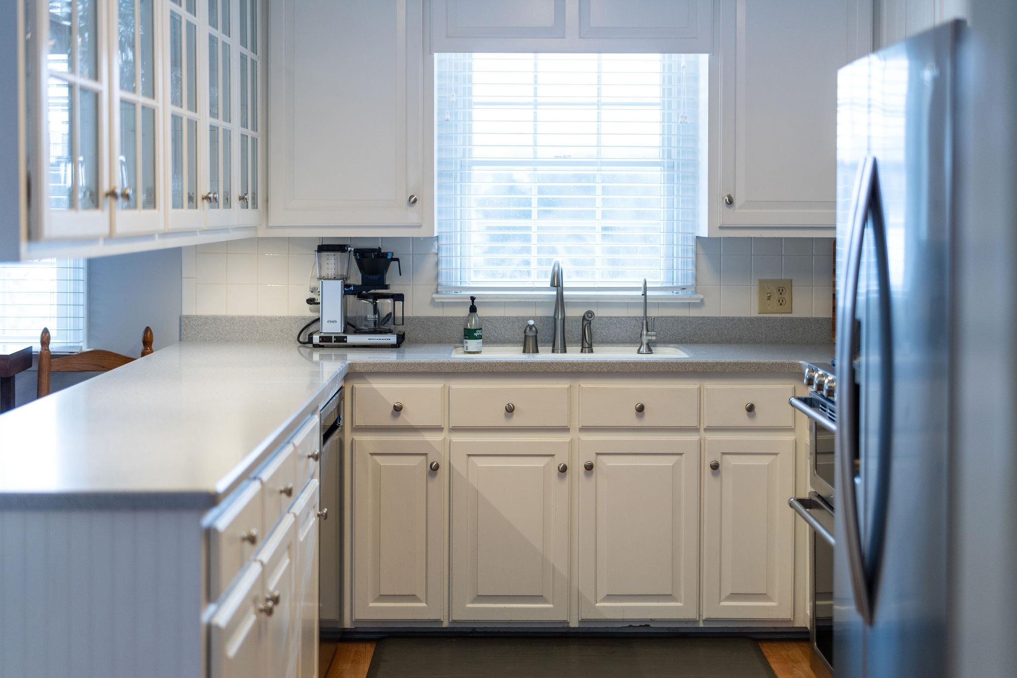 769 Cattle Scales Road Waynesboro, VA 22980 - Photo 19 of 75 a kitchen with cabinets appliances a sink and a window