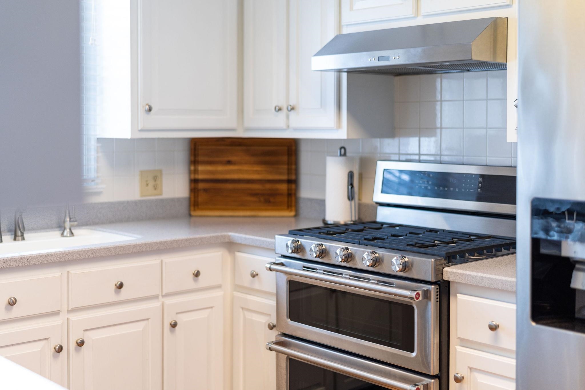 769 Cattle Scales Road Waynesboro, VA 22980 - Photo 21 of 75 a kitchen with granite countertop white cabinets and appliances