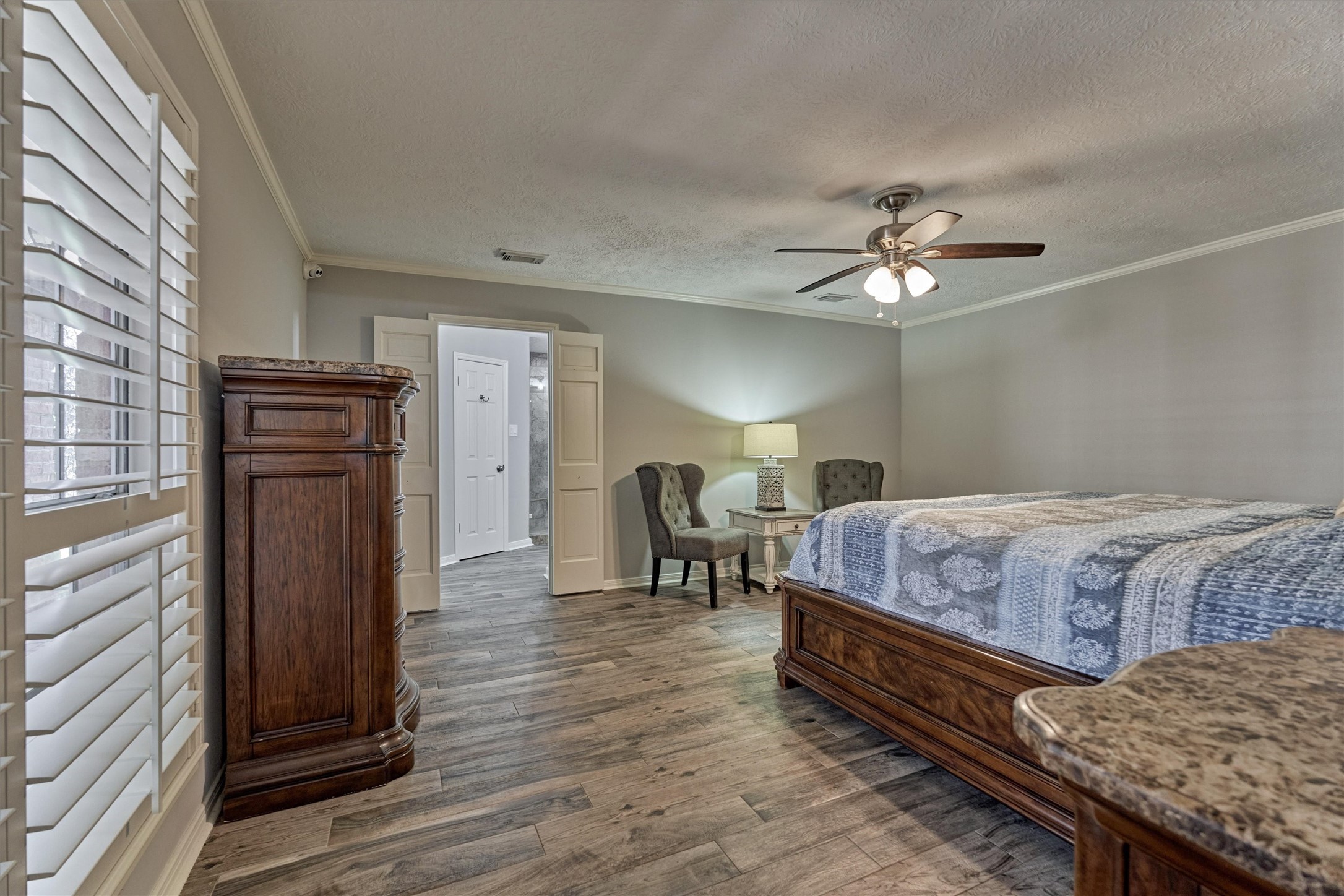 6522 Castle Pine Lane Spring, TX 77379 - Photo 10 of 49 a bedroom with a bed and a chandelier