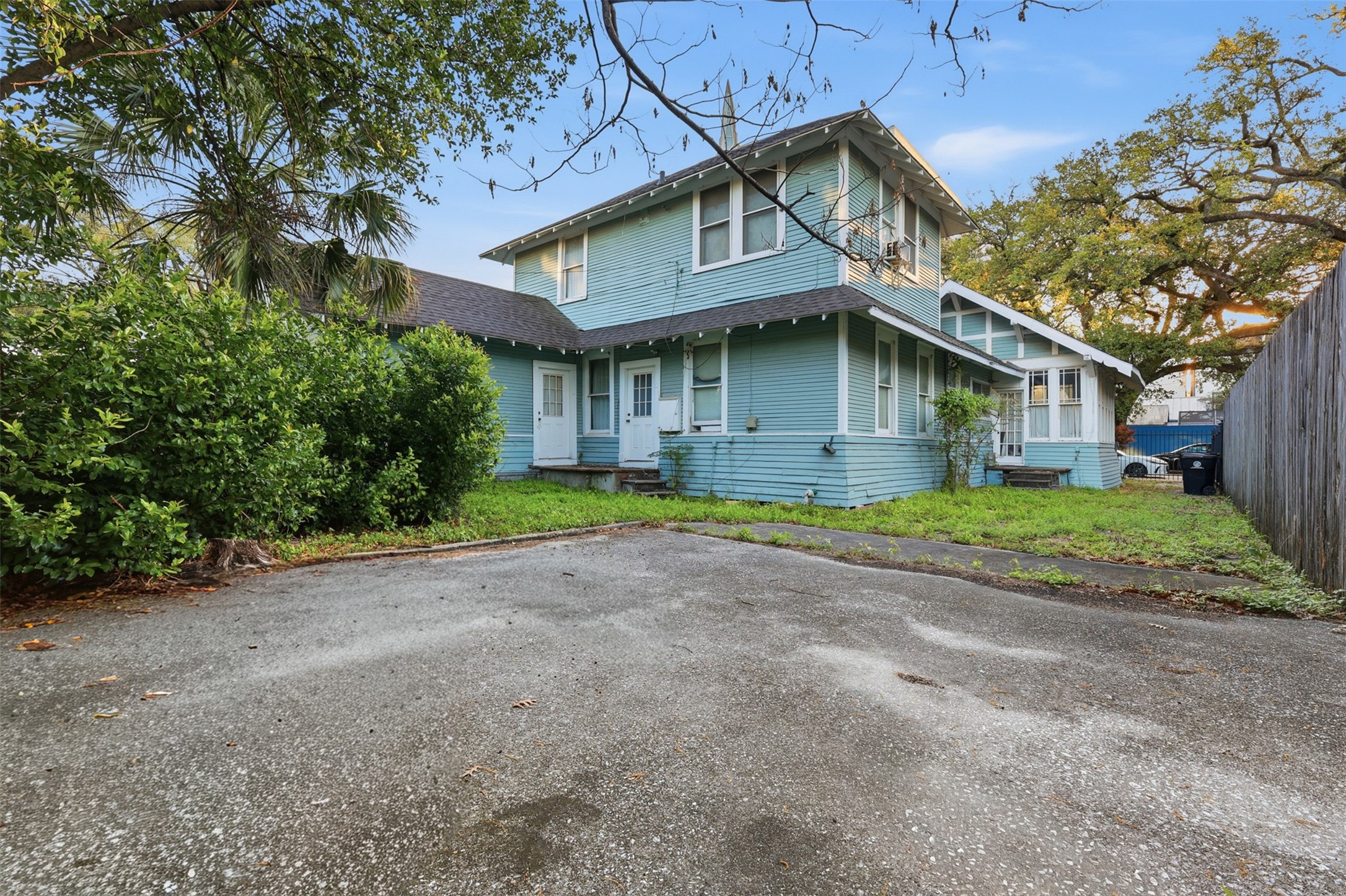3308 Yupon Street Houston, TX 77006 - Photo 11 of 20 a front view of a house with a garden and trees