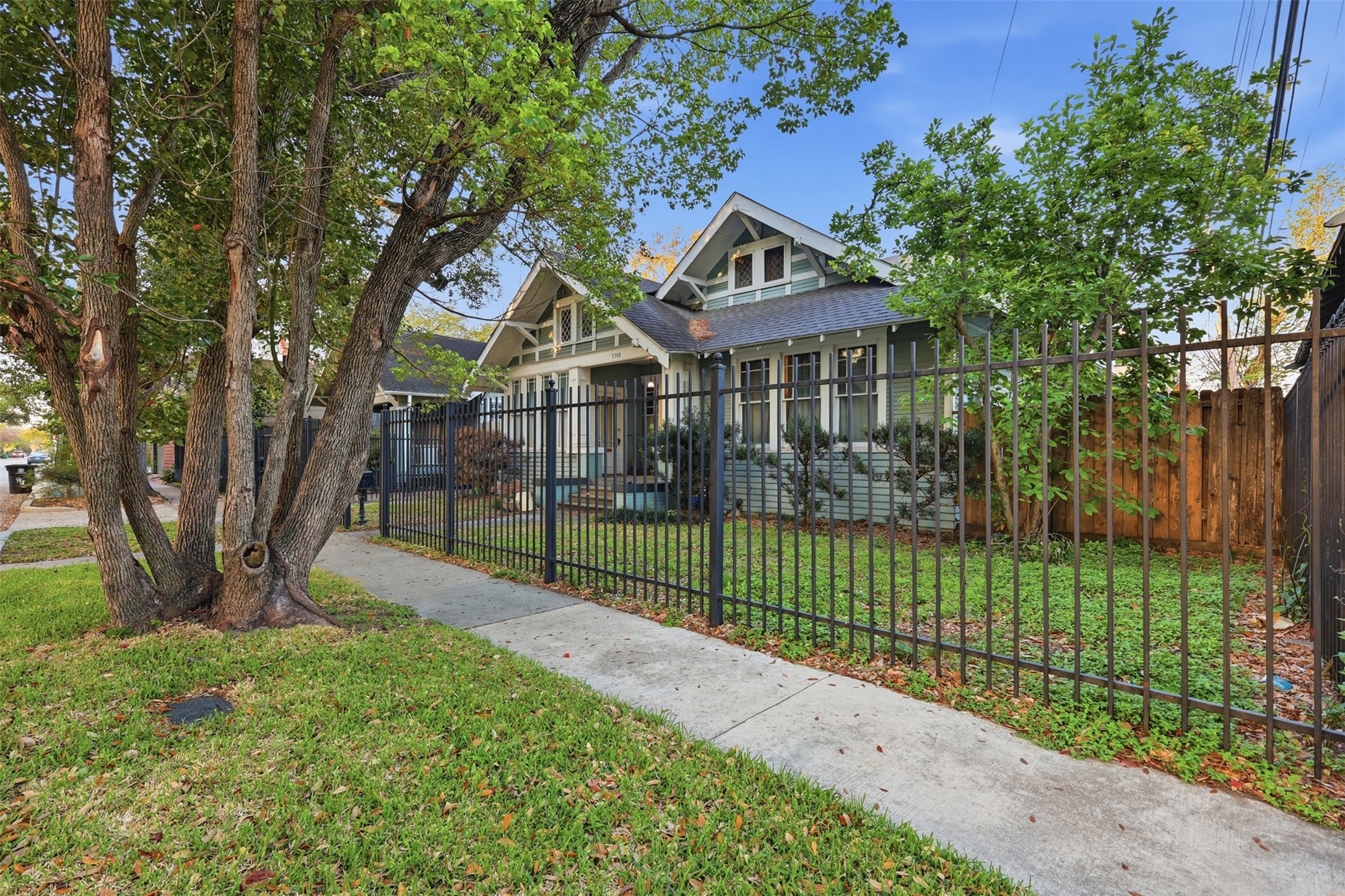 3308 Yupon Street Houston, TX 77006 - Photo 8 of 20 a front view of a house with a garden and plants