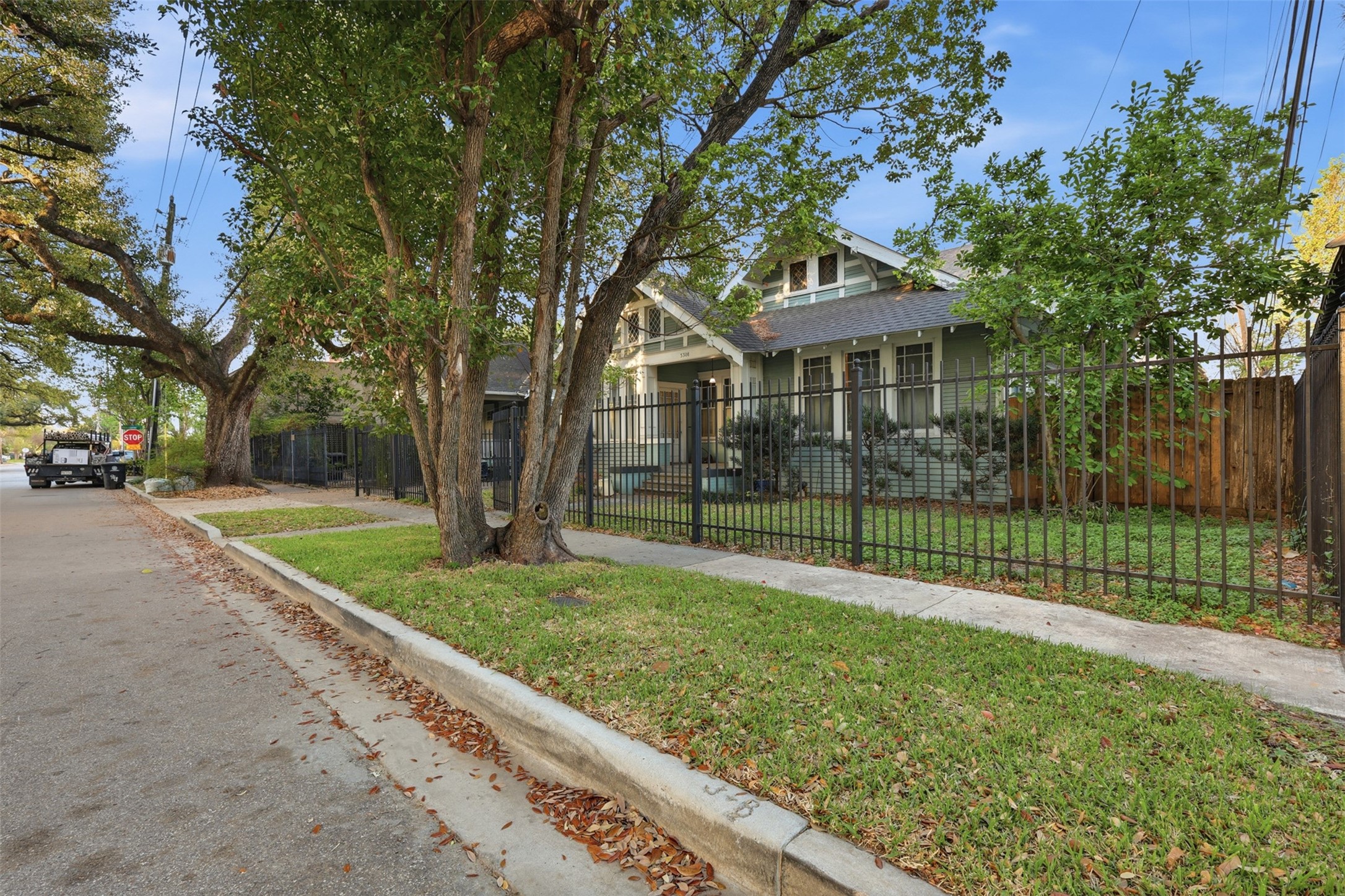 3308 Yupon Street Houston, TX 77006 - Photo 10 of 20 a view of a house with a yard and potted plants