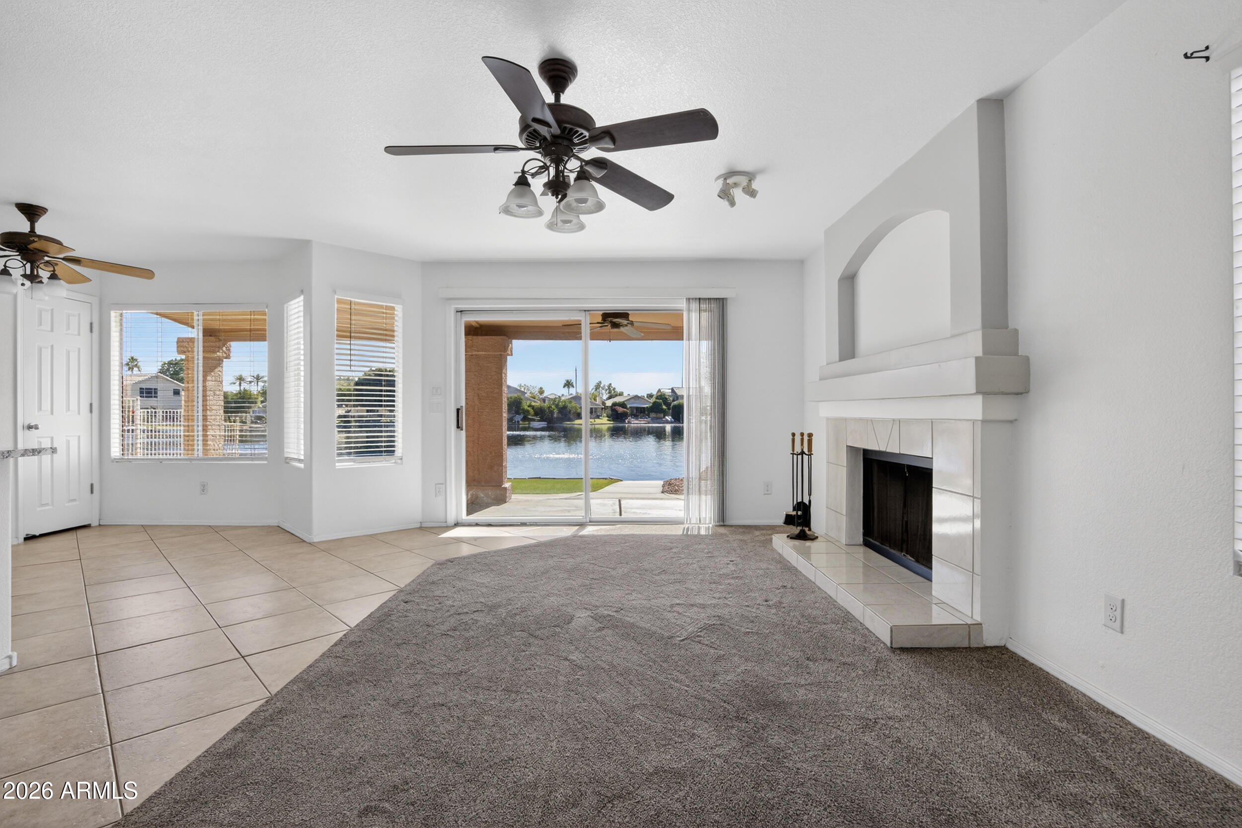 1363 East Butler Circle Chandler, AZ 85225 - Photo 15 of 41 a view of an empty room with a fireplace and a window