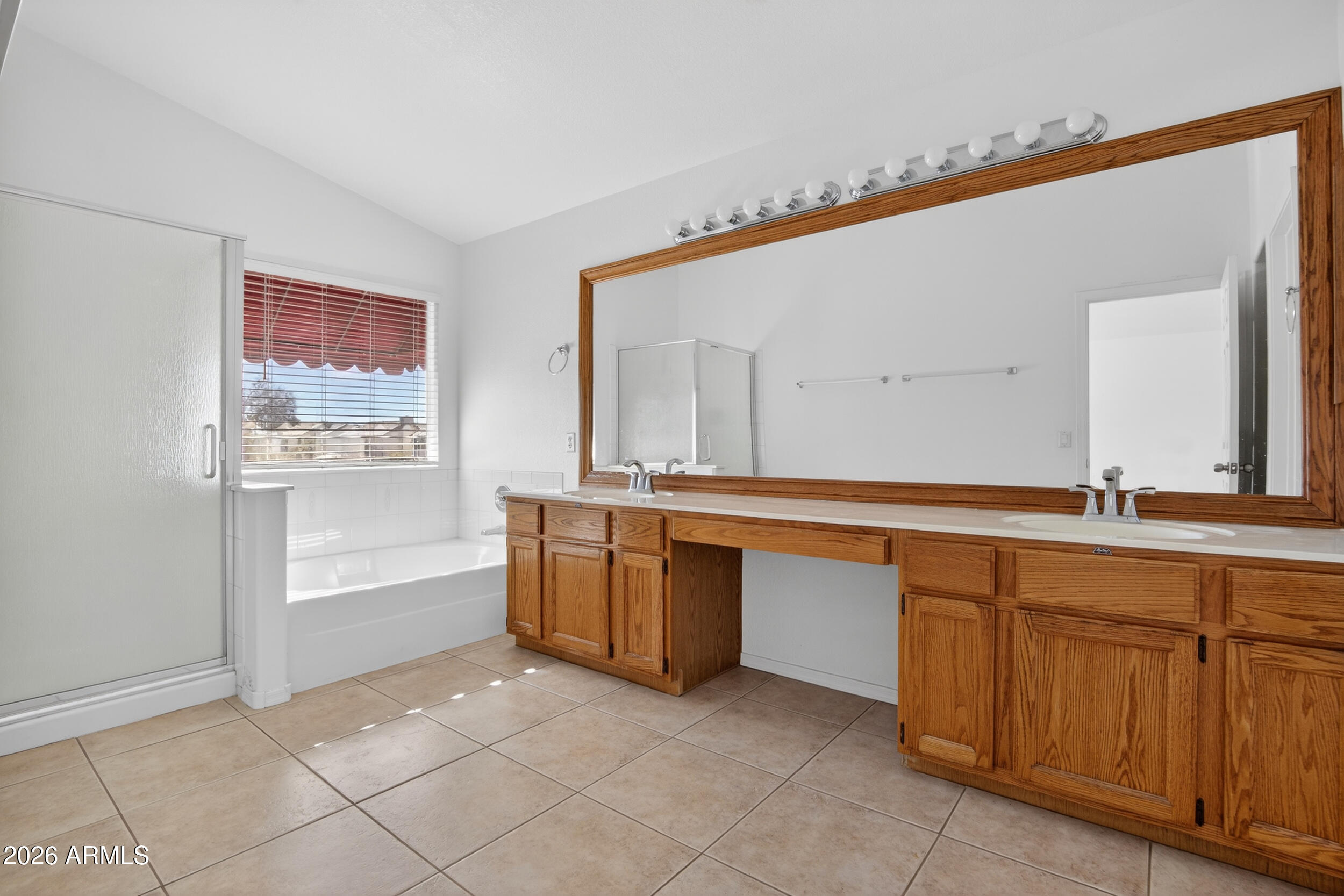 1363 East Butler Circle Chandler, AZ 85225 - Photo 19 of 41 a spacious bathroom with a tub sink and mirror