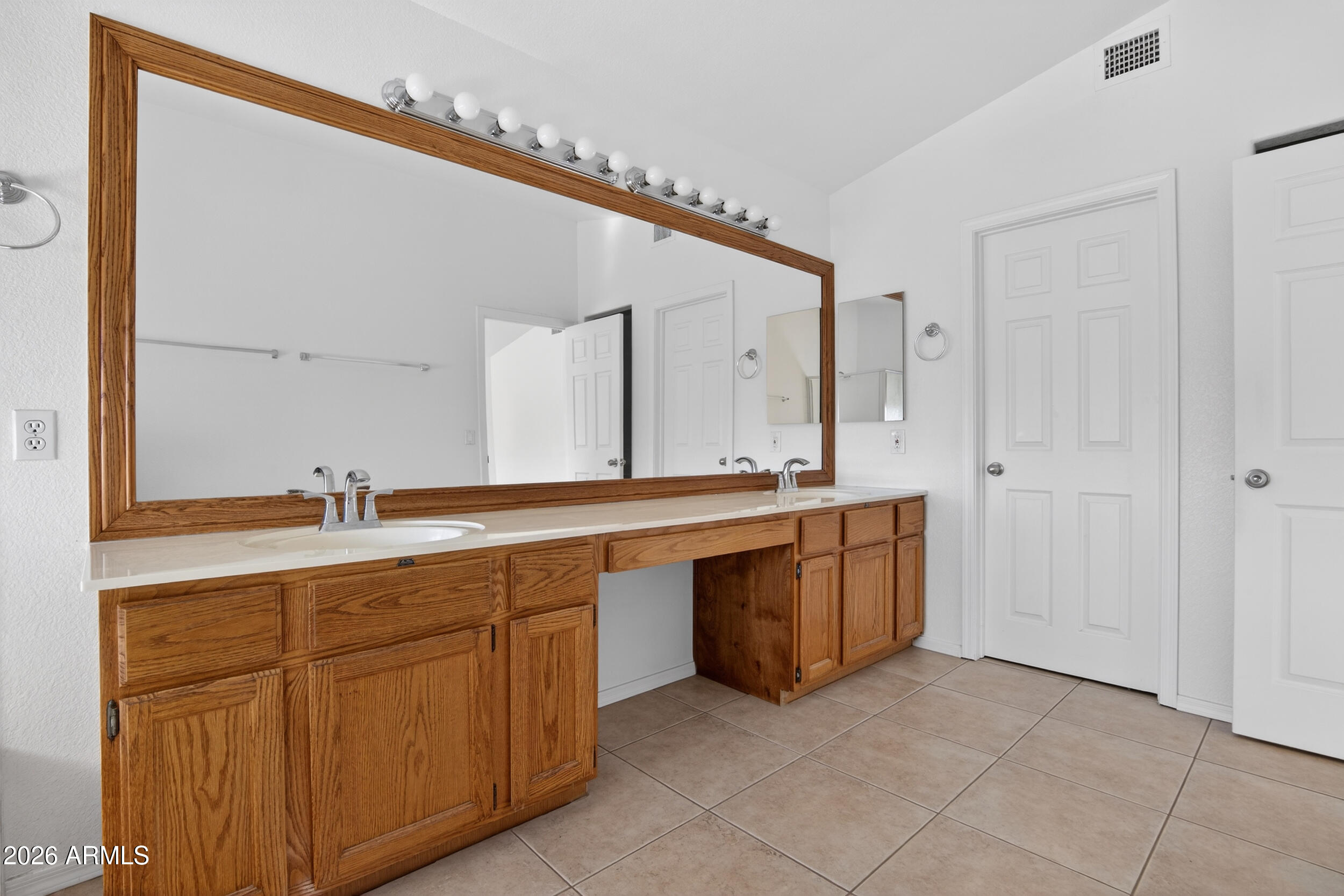 1363 East Butler Circle Chandler, AZ 85225 - Photo 21 of 41 a spacious bathroom with a granite countertop sink and a mirror