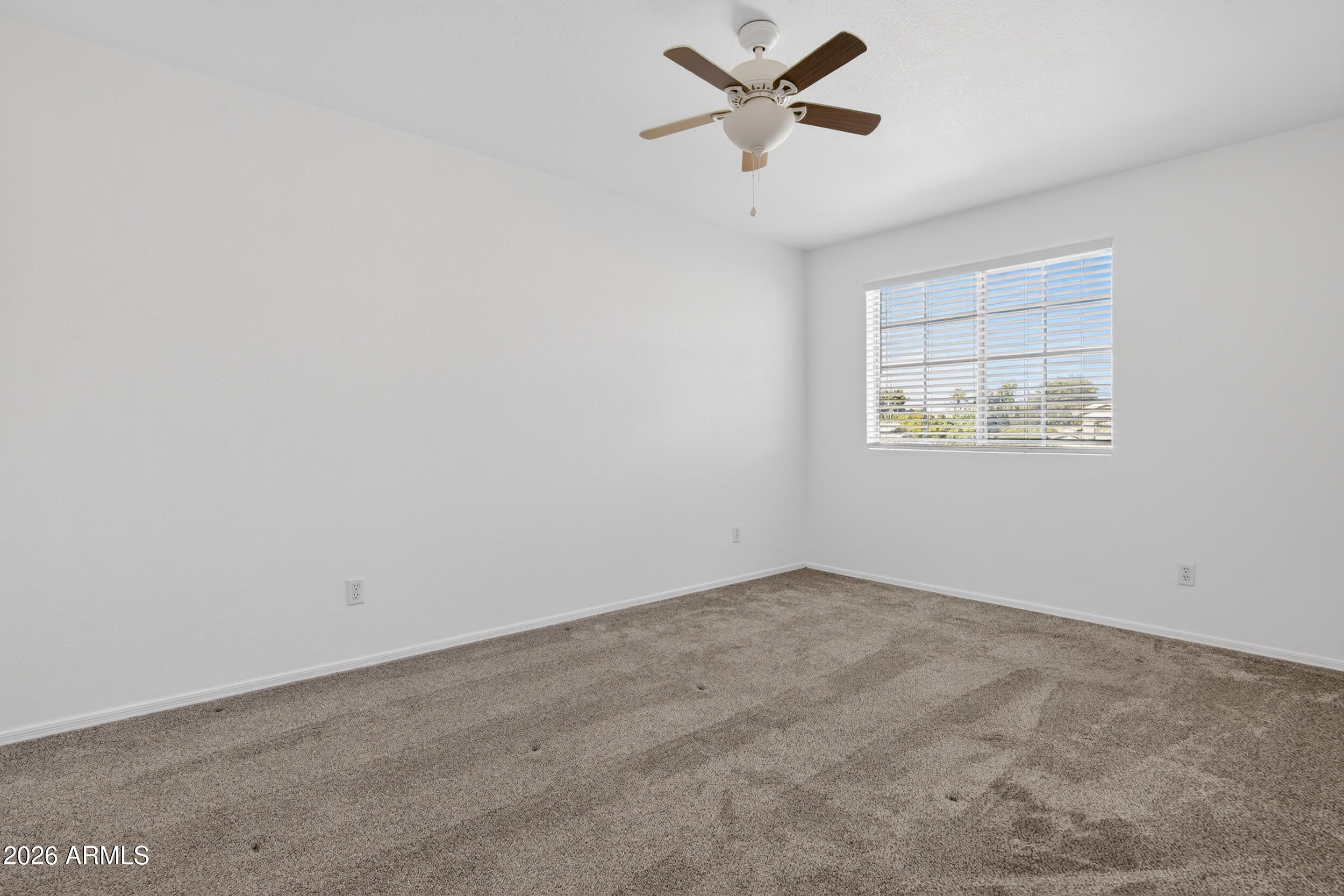 1363 East Butler Circle Chandler, AZ 85225 - Photo 25 of 41 an empty room with a window and a fan