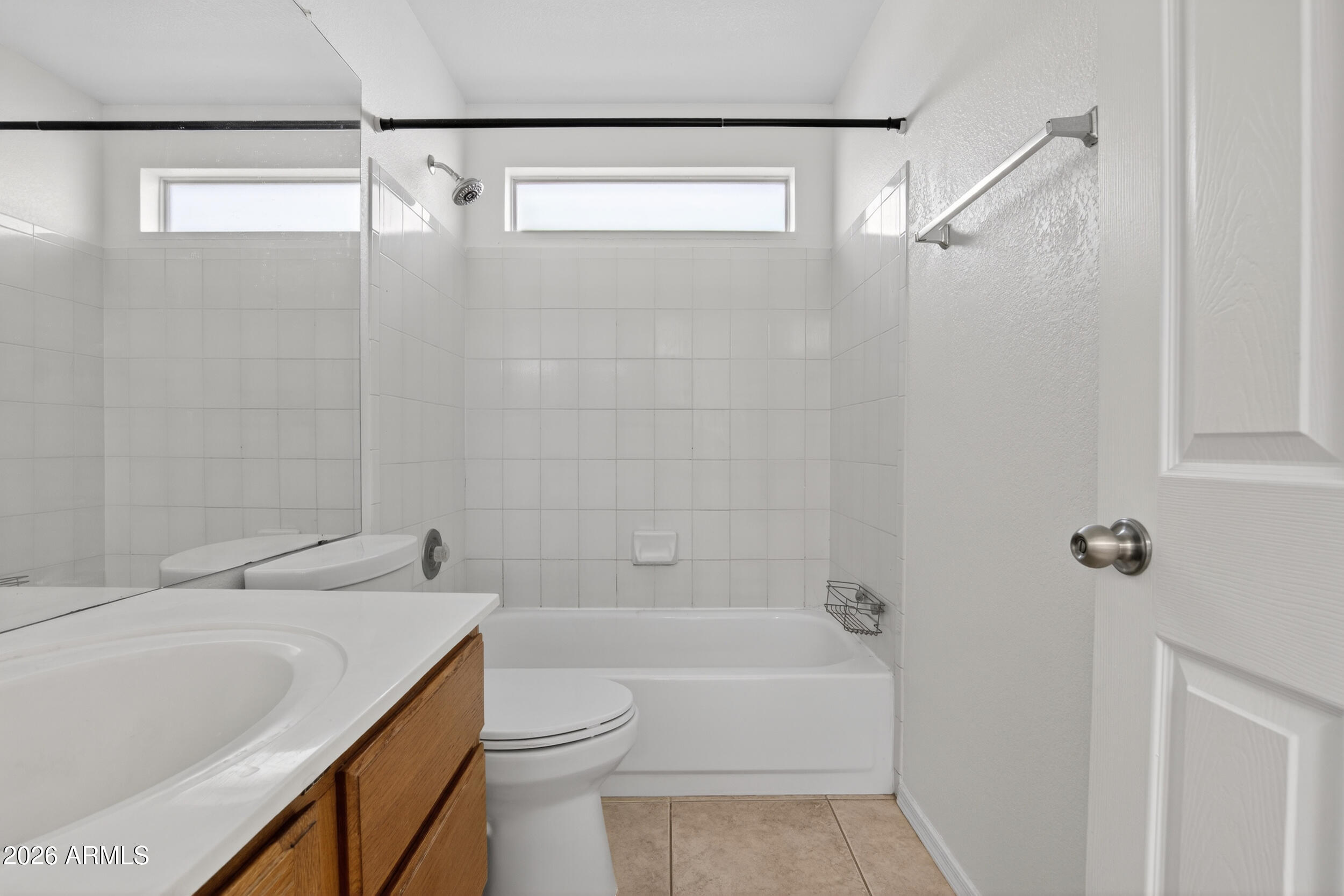 1363 East Butler Circle Chandler, AZ 85225 - Photo 28 of 41 a bathroom with a bathtub shower sink vanity and toilet