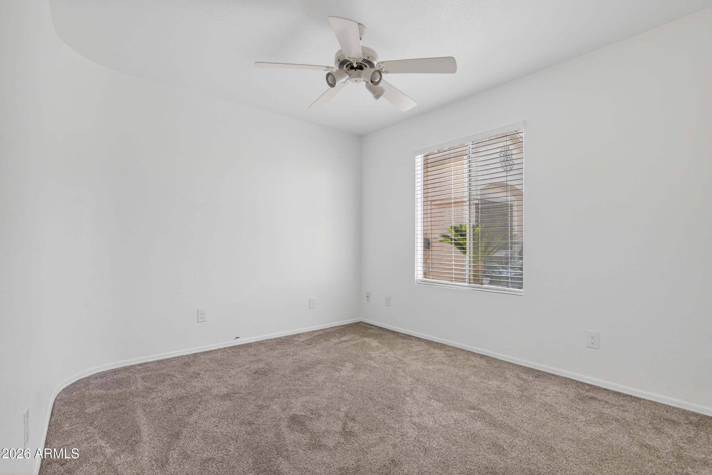 1363 East Butler Circle Chandler, AZ 85225 - Photo 29 of 41 an empty room with windows and fan