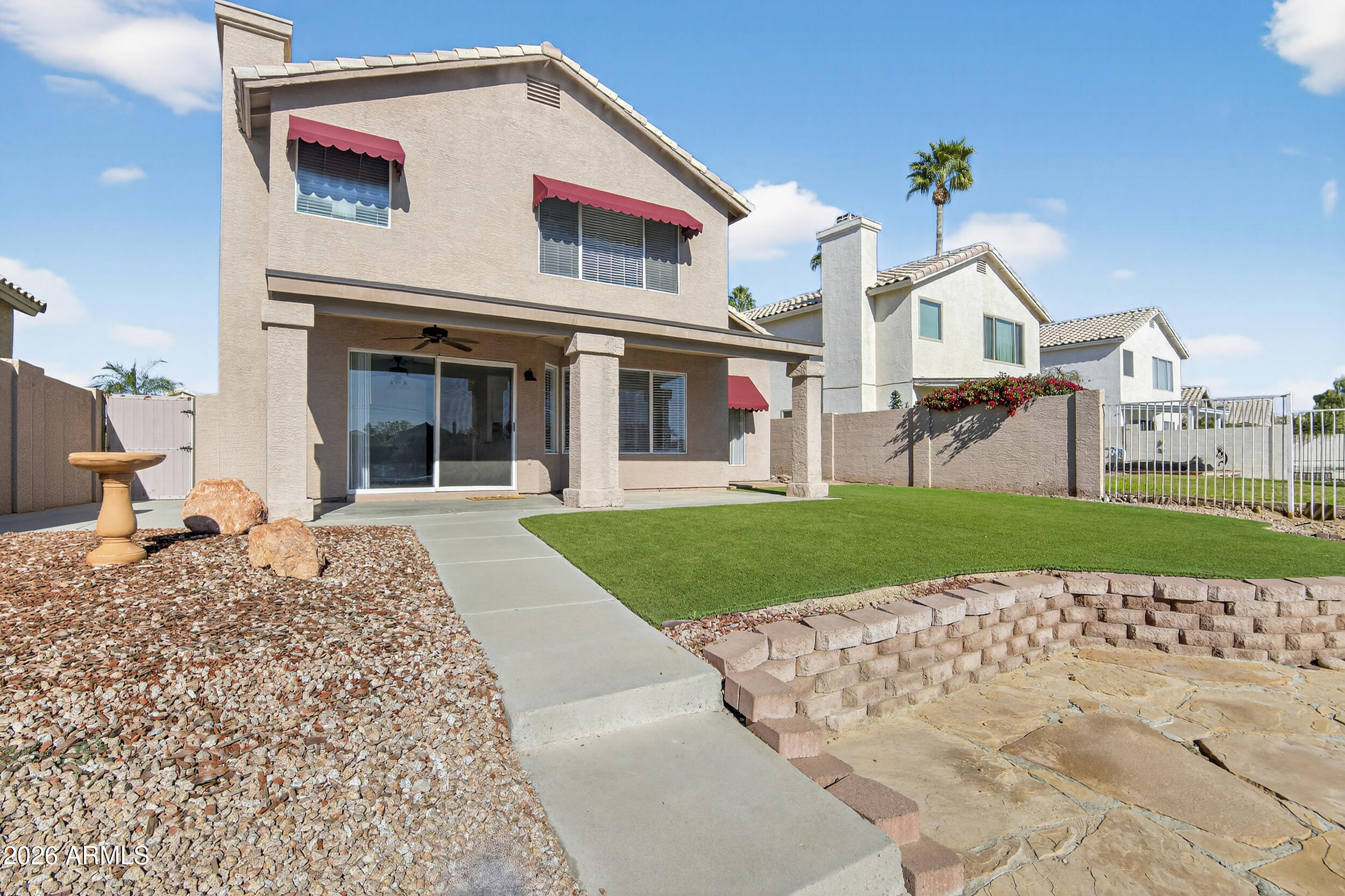 1363 East Butler Circle Chandler, AZ 85225 - Photo 40 of 41 a front view of a house with a yard
