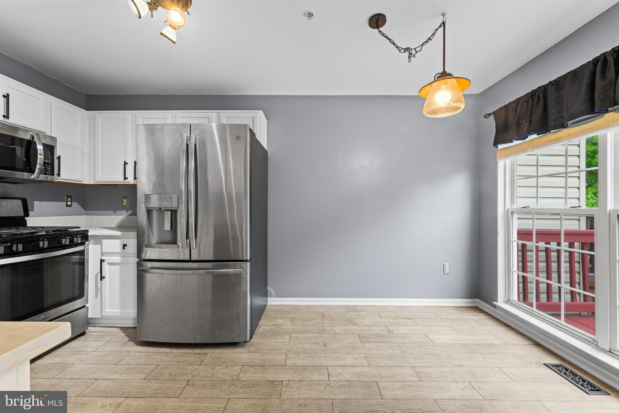 4521 Ingham Road Owings Mills, MD 21117 - Photo 10 of 32 Modern kitchen with sleek appliances.