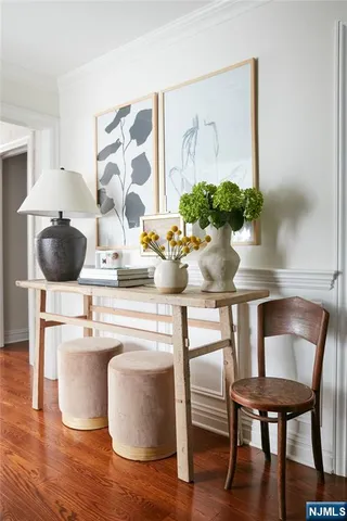 a dining room with furniture and wooden floor