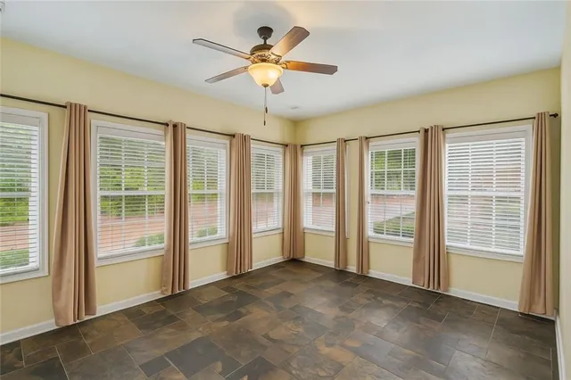 a front view of a house with outdoor seating