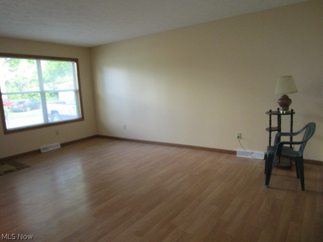 260 Cummings Road Vermilion, OH 44089 - Photo 2 of 33 laminated floor in the front family room with newer blinds on the windows