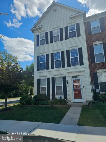 a view of a brick building next to a yard