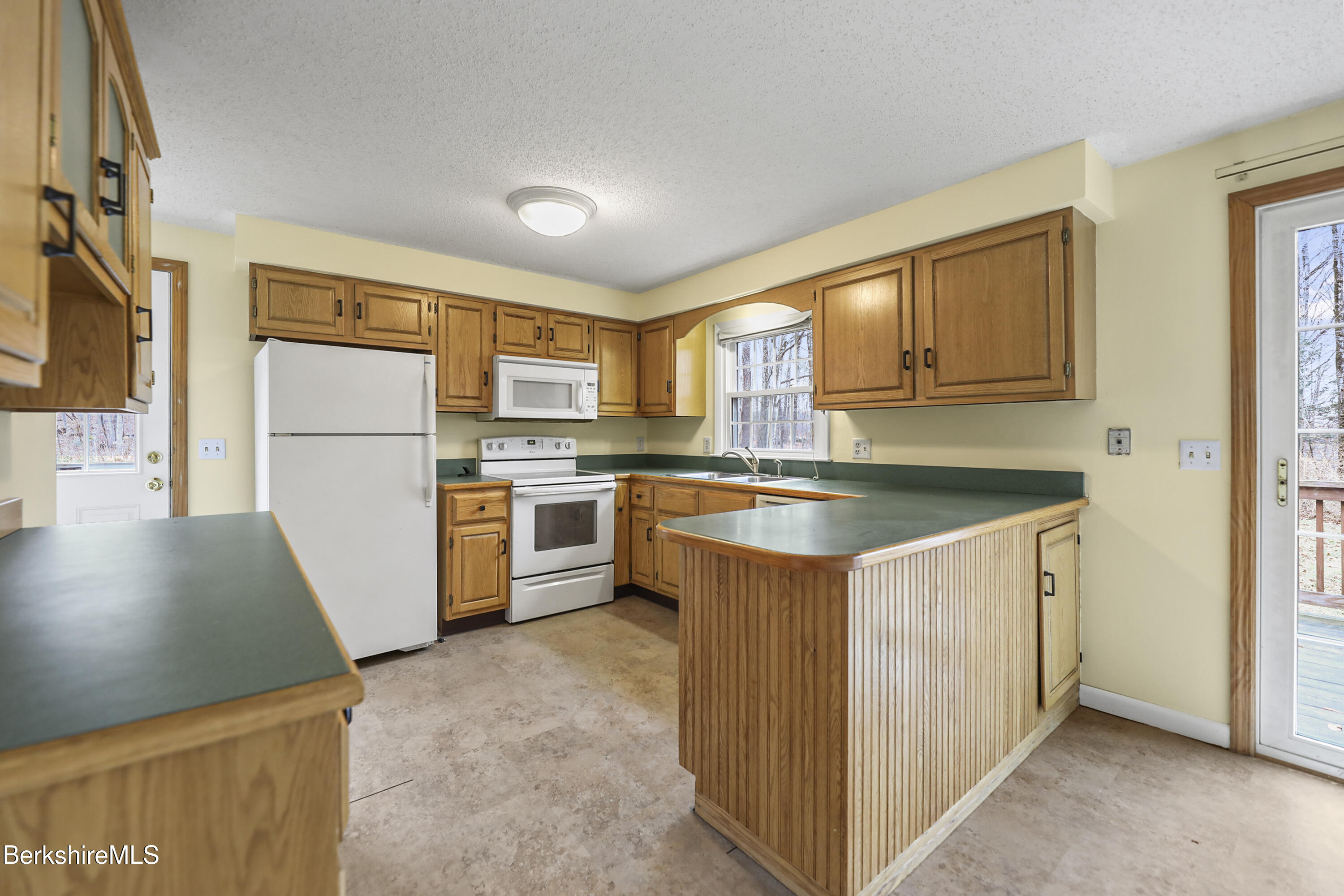 2271 Jacobs Ladder Road Becket, MA 01223 - Photo 13 of 28 a kitchen with a refrigerator sink and microwave